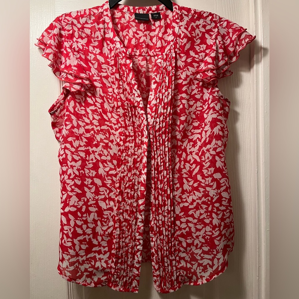 Red ruffle sleeve button-up blouse with white flower design